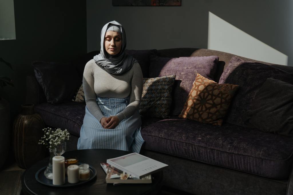 Photo by cottonbro studio: https://www.pexels.com/photo/woman-in-gray-long-sleeve-shirt-sitting-on-gray-couch-4620783/